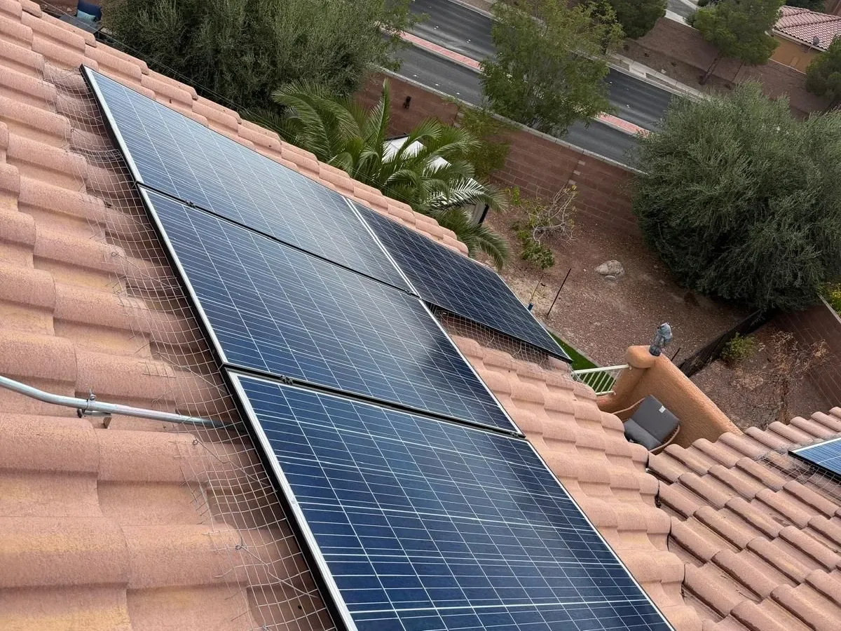 Solar array on a tile roof, cleared of nesting debris